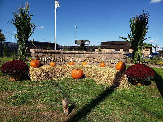 main corner sign decorated for fall